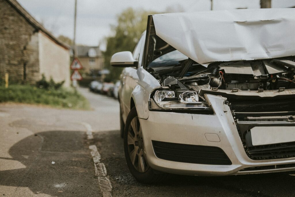 Wrecked car parked on the street after a car crash